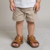 Baby Wearing a Tan Sandal. Happy Baby, Comfortable baby. Comfortable shoes